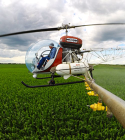 Helicopter pesticide sprayer arm