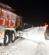 Snow plow during storm