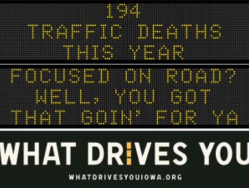 Traffic roadside graphic with text of the news article title.