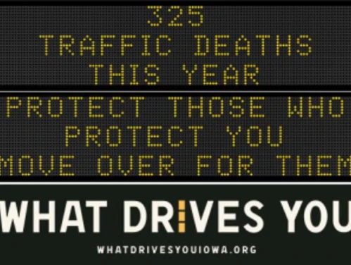 Traffic roadside graphic with text of the news article title.