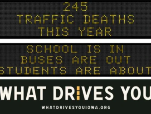 Traffic roadside graphic with text of the news article title.