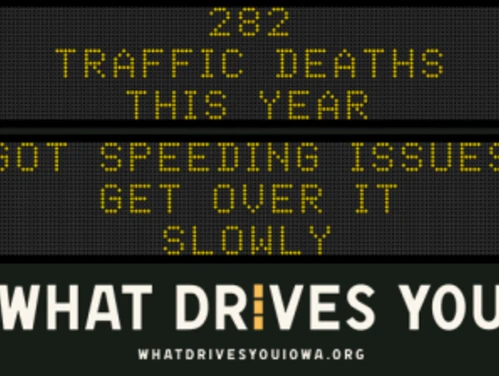 Traffic roadside graphic with text of the news article title.