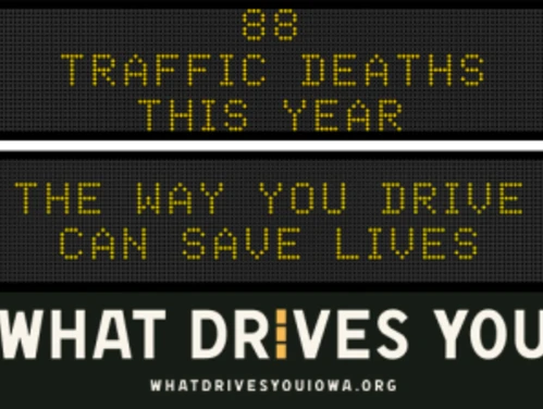 Traffic roadside graphic with text of the news article title.