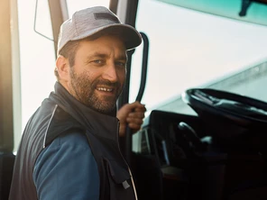 Man climbing into large truck